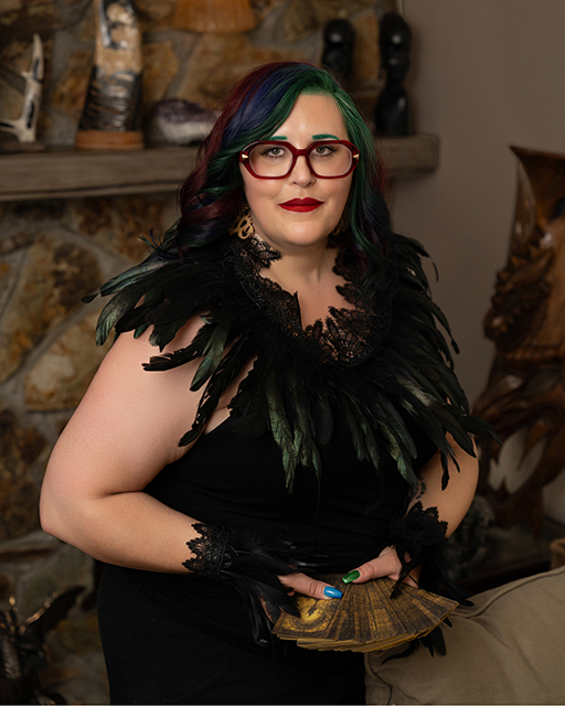 Raven with a tarot deck.
