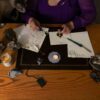 Raven sealing a letter.