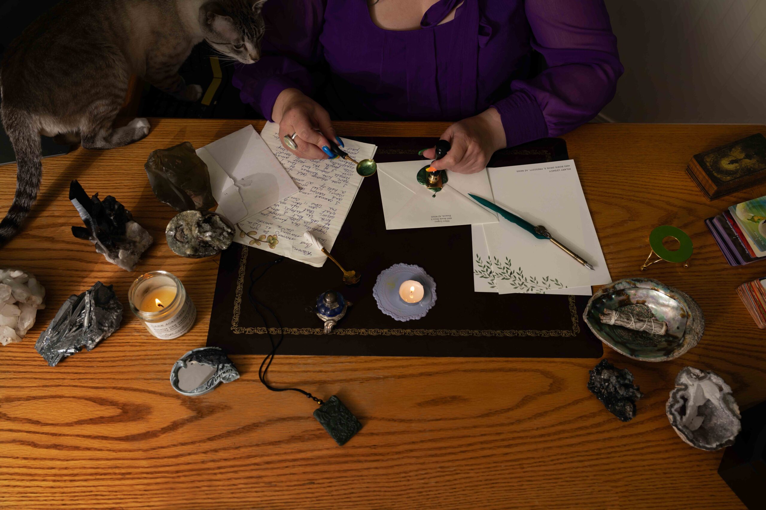 Raven sealing a letter.